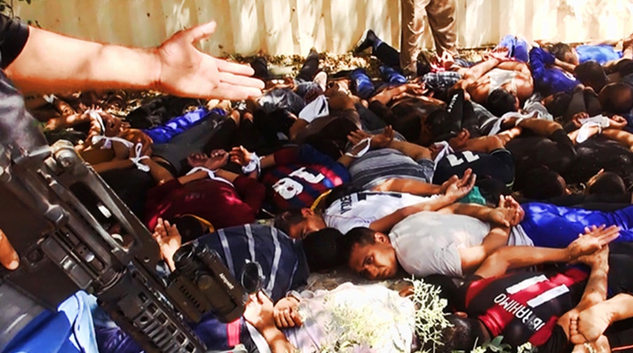 Report: Photos released of mass execution of Iraqi soldiers