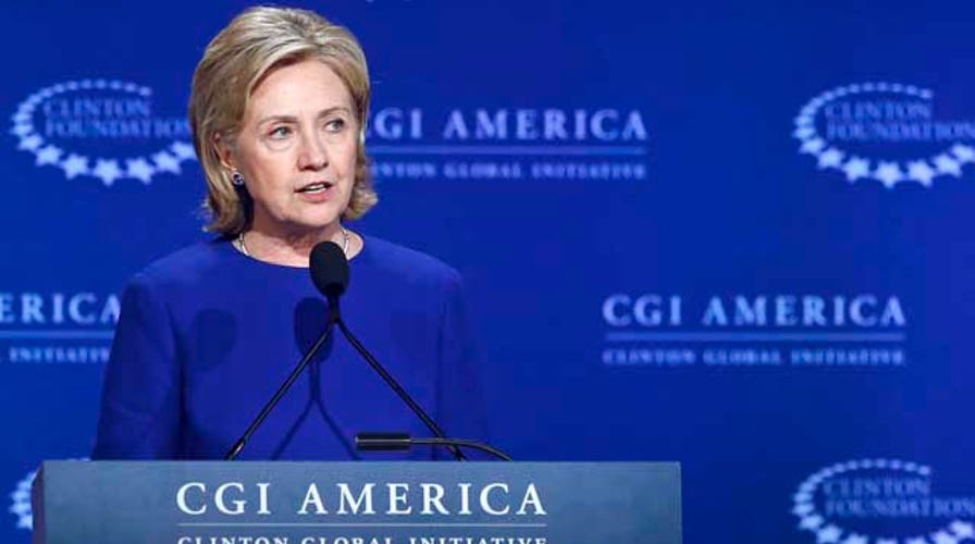 Hillary pressed on wealth