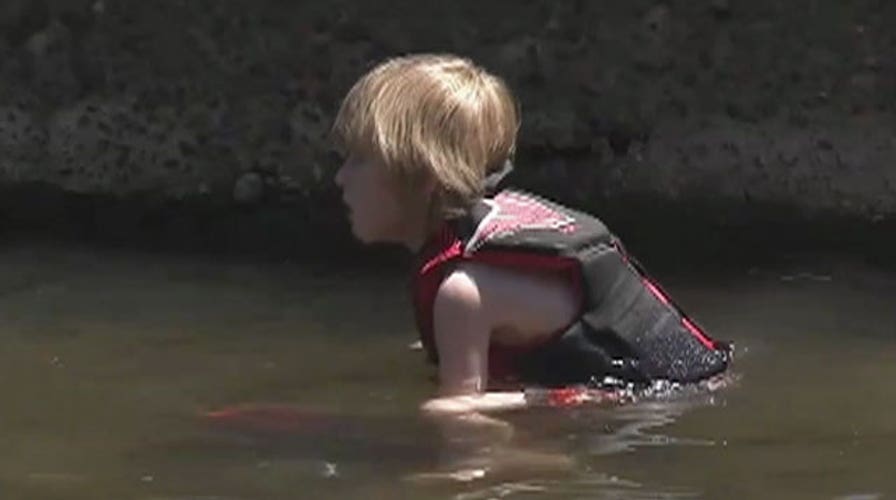 Teenager saves drowning brother