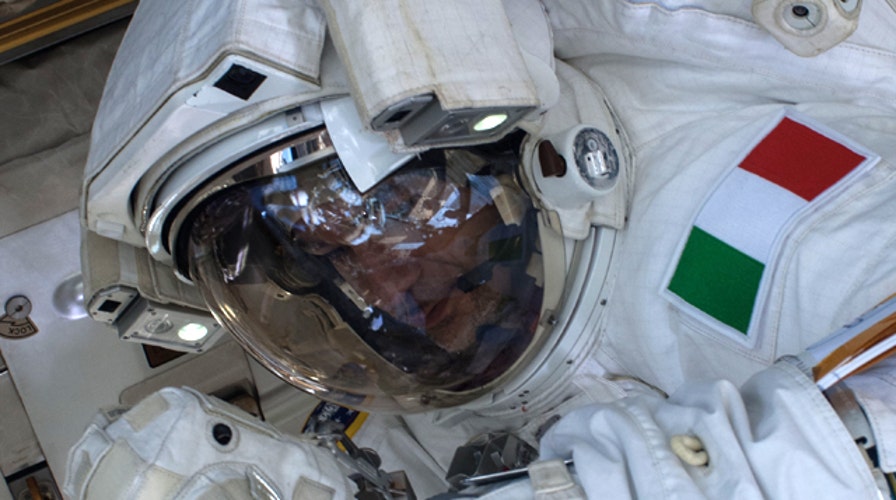 Spacewalk aborted after astronaut nearly drowns in own suit