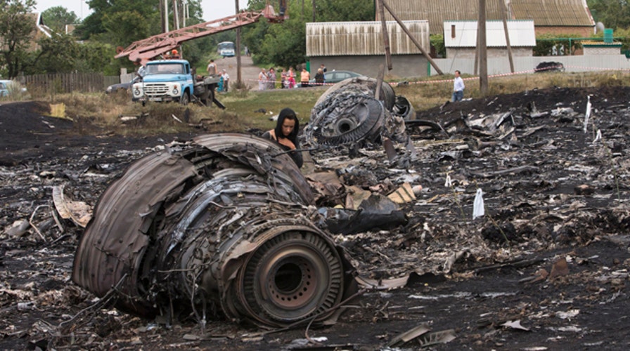Investigators search for answers on plane downing in Ukraine