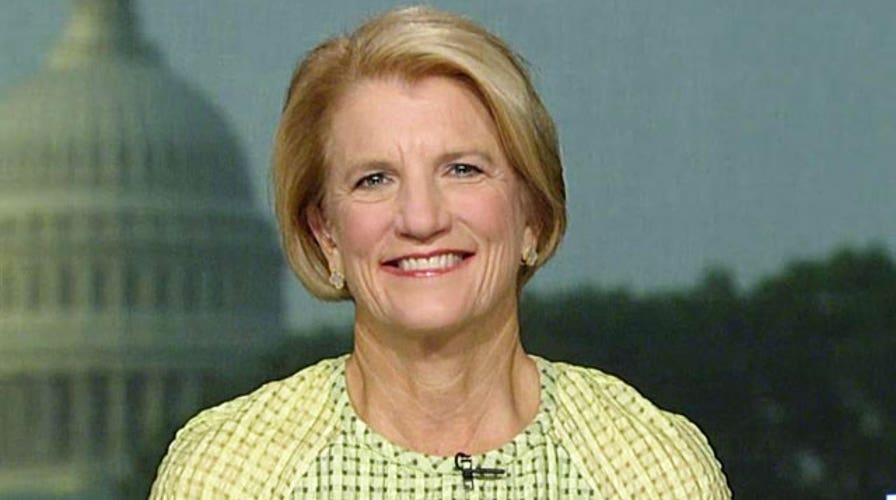 Senate candidate seeks to tie opponent to President Obama