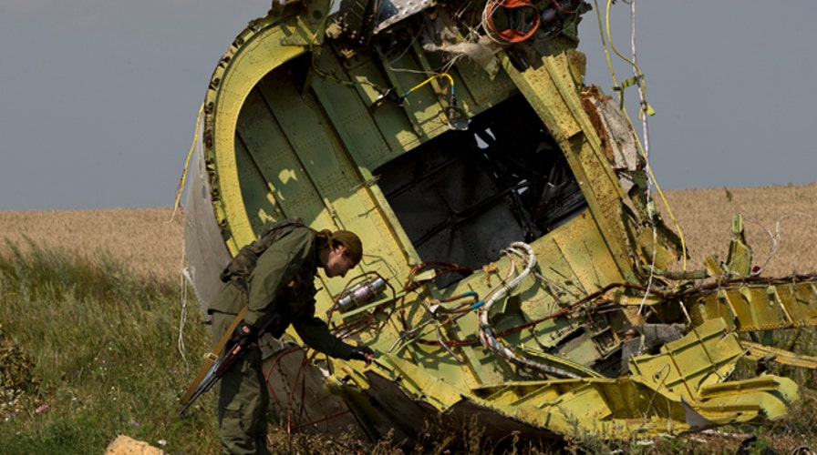 Dutch, Australian experts gain access to MH17 crash site