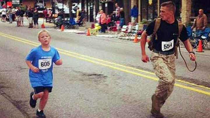 Marine helps boy finish 5K run