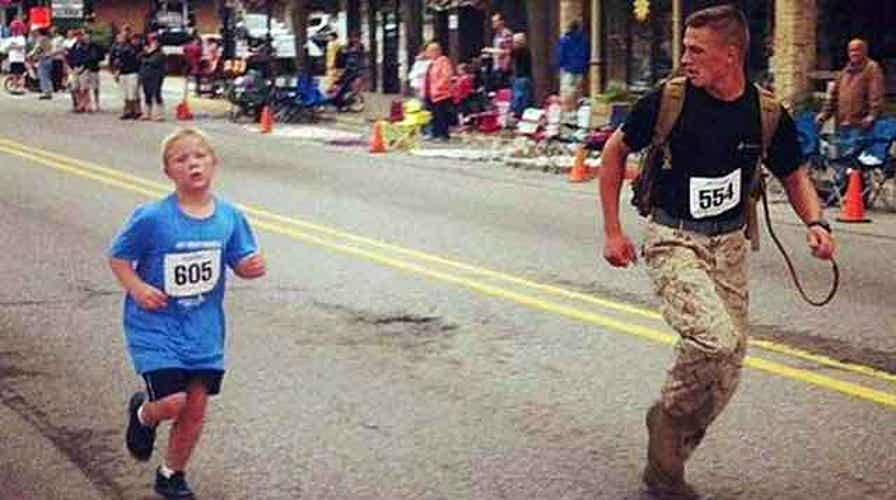 Marine helps boy finish 5K run