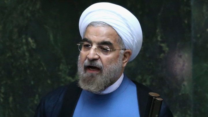 Iran swears in former top nuclear negotiator as president