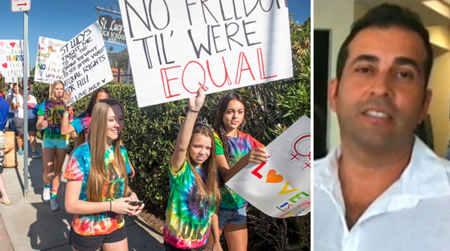Rally to support gay teacher fired from Catholic school