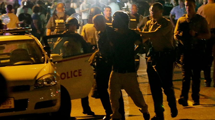 31 arrested, 2 shot as protests turn violent in Ferguson