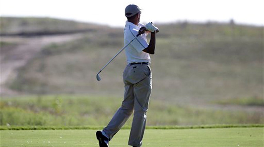 Obama under fire for golfing minutes after Foley statement