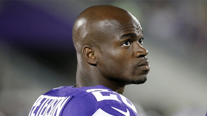 Vikings running back Adrian Peterson turns himself in