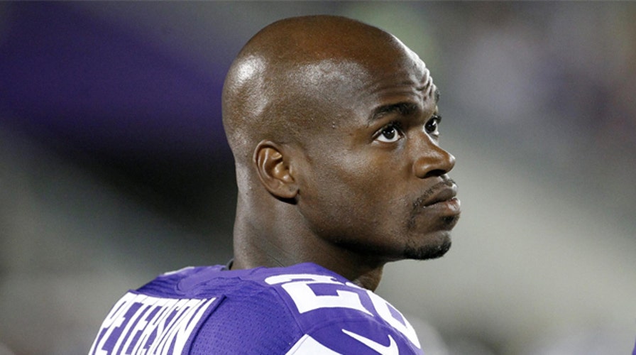 Vikings running back Adrian Peterson turns himself in