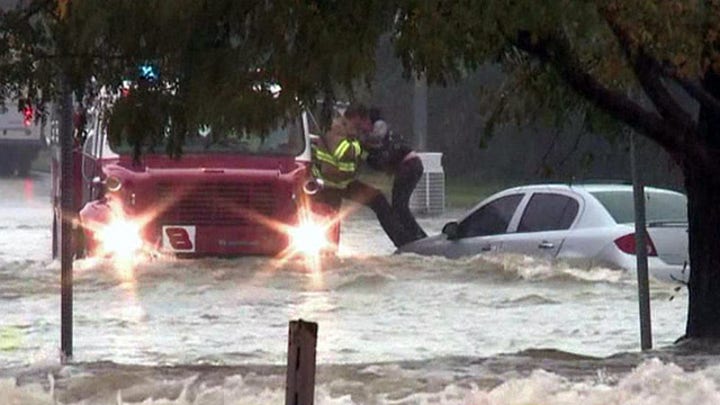 Helicopter crews rescue flood victims, drop supplies