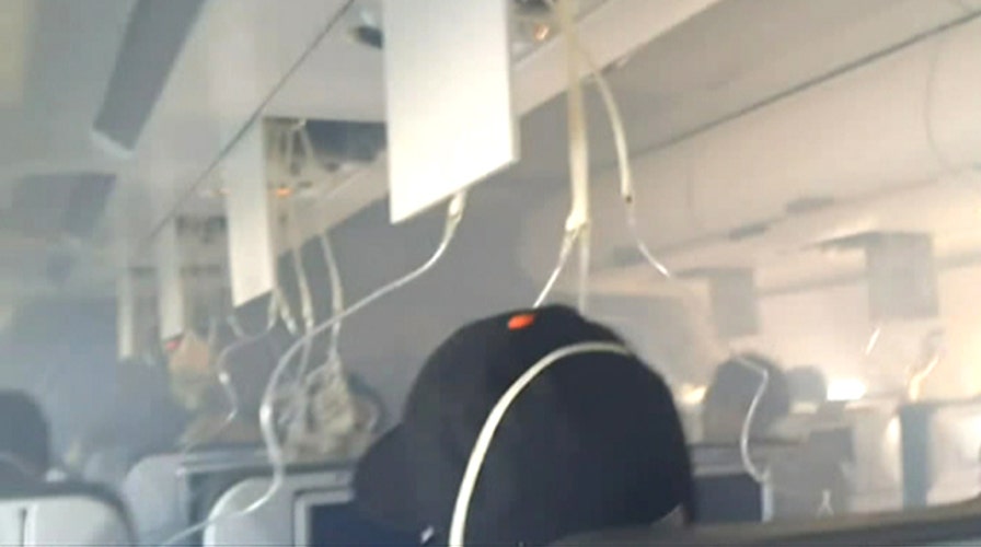 Frightening video inside plane as cabin fills with smoke