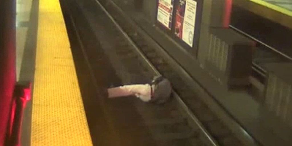 Scary situation Man falls onto train tracks in Boston Fox News Video