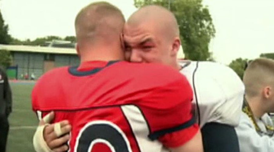 US airman surprises son at high school football game