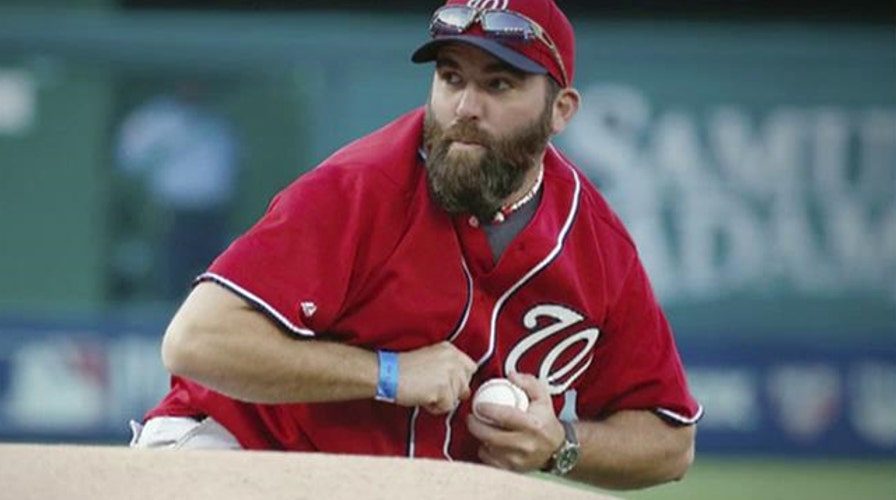Army vet mimics grenade toss in opening pitch