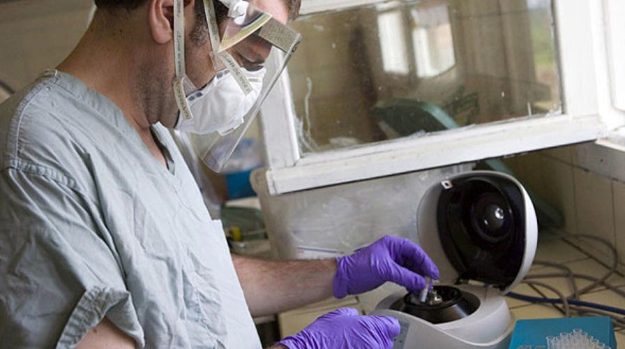 The battle for Ebola drugs