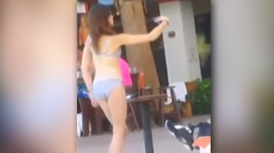What won’t she do to get the perfect bikini selfie?