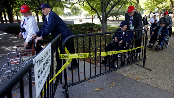 Military groups meet at WWII memorial to protest slimdown