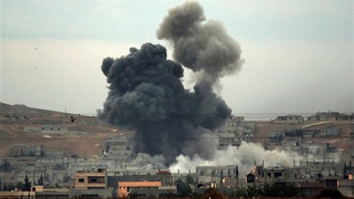 Kurdish fighters battle to reclaim Kobani from ISIS