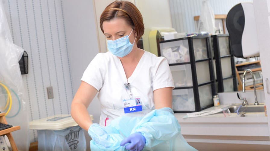 US Ebola spread, protective gear, smoking risk spike