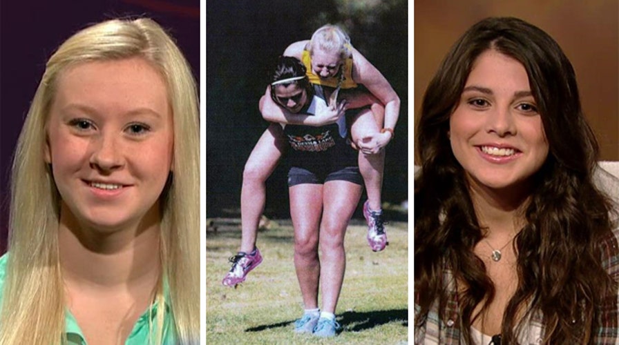 High school runner carries injured opponent