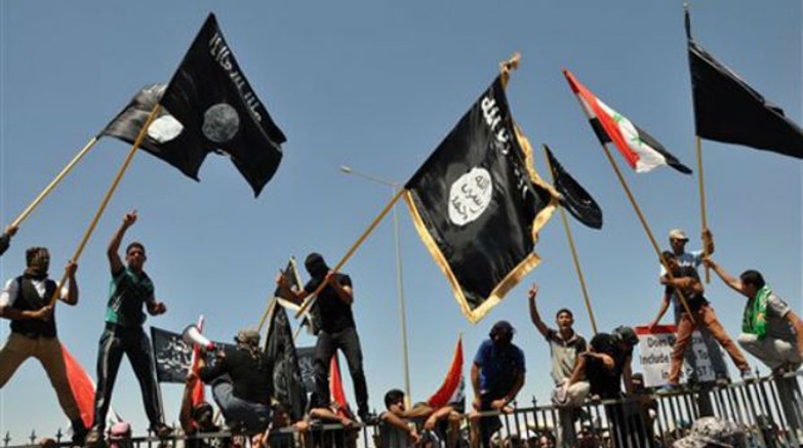 ISIS militants launch about 15 near-simultaneous attacks