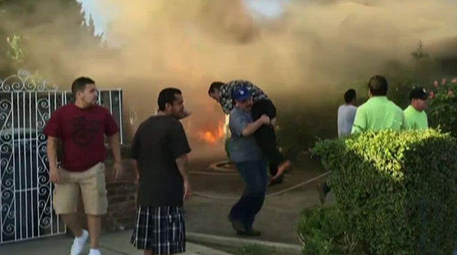 Stranger rescues man from burning house