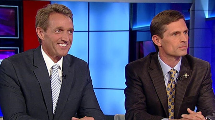 Opposing lawmakers work together to survive on island