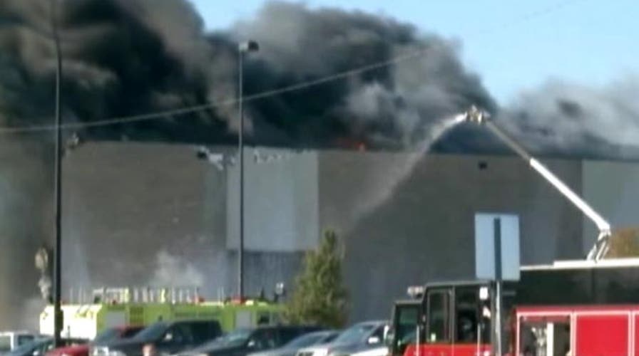 4 dead, 4 missing after plane crashes into building