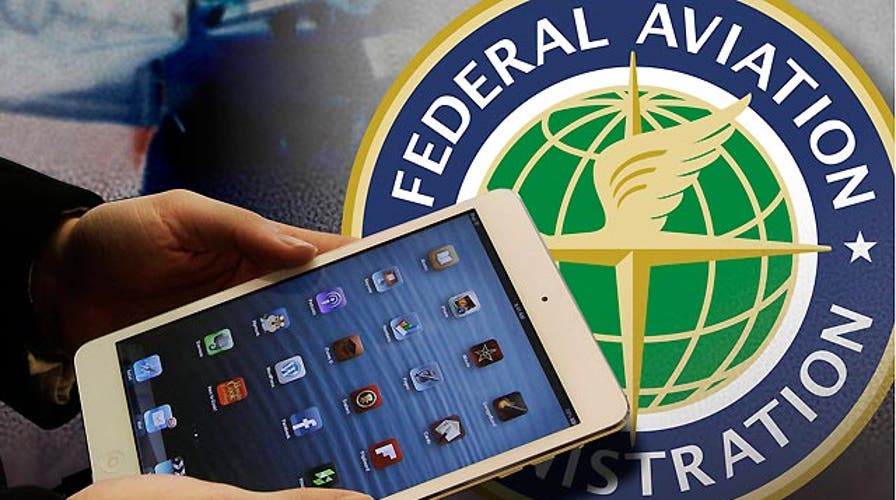 FAA eases gadget restrictions on planes