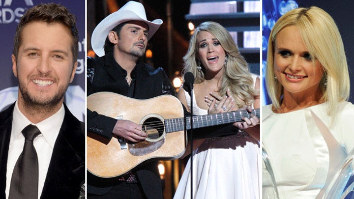 Country stars take aim at Obama; Lambert, Bryan win big 