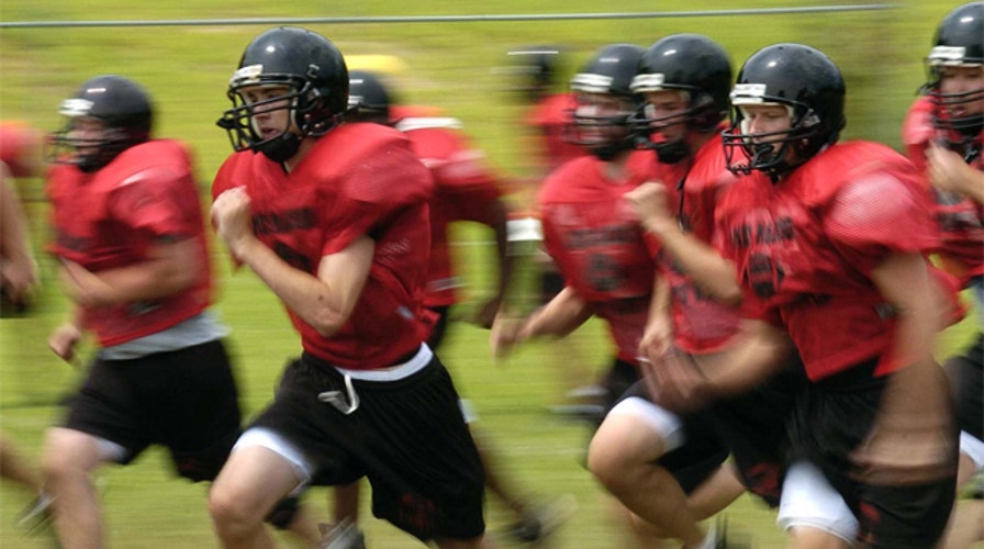 Debate over letting high school kids play football