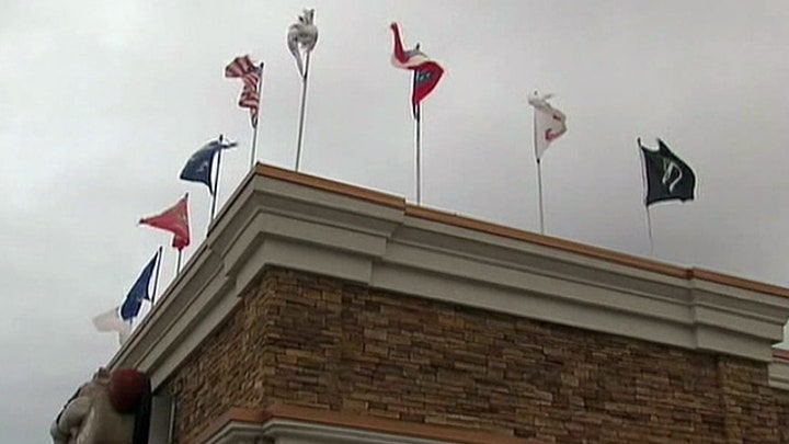 Georgia restaurant owner cited for flying flags