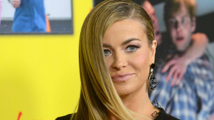 Carmen Electra works out with paparazzi in tow