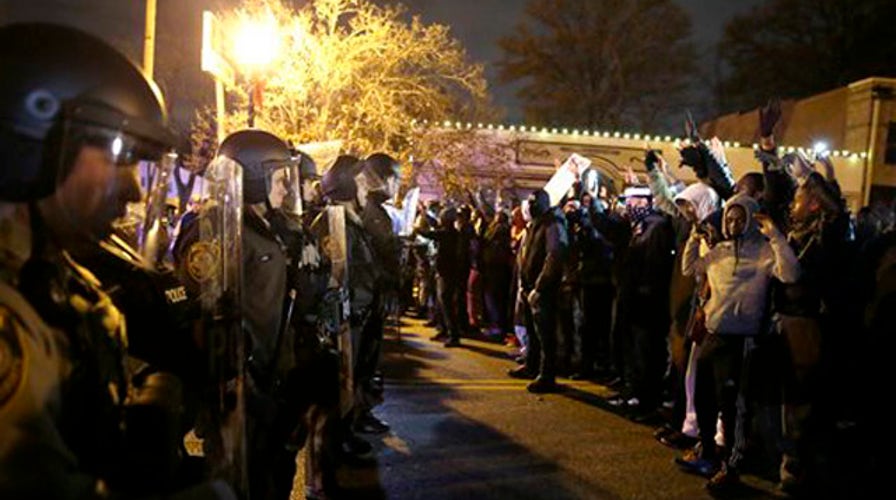 Tactical police attempt to disperse protesters