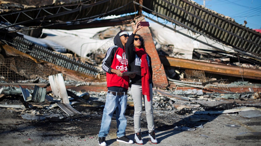 Looted Ferguson business owners try to pick up pieces