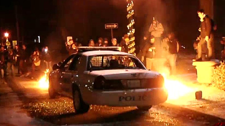 Rioters torch cop car; 44 arrested overnight in Ferguson
