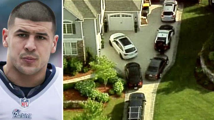 Authorities search for sneakers in Aaron Hernandez's home