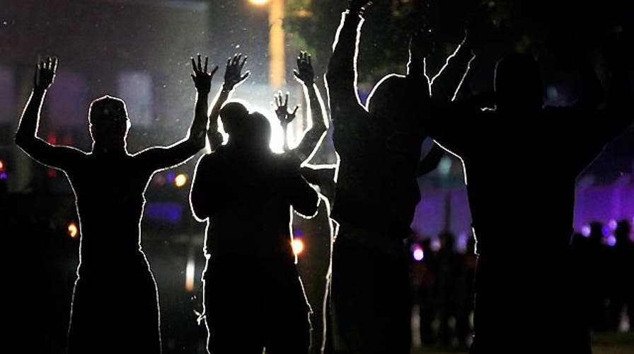Ferguson 'hands up, don't shoot!' rallying cry questioned