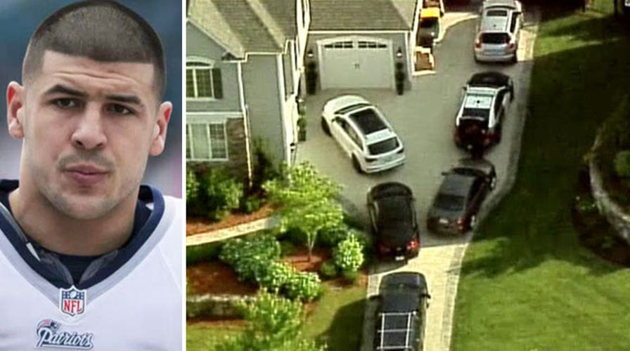 Authorities search for sneakers in Aaron Hernandez's home