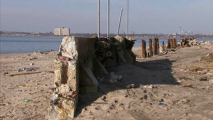 Sandy victims demand government build sea walls