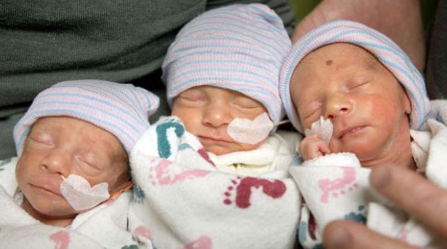 Rare identical triplets born