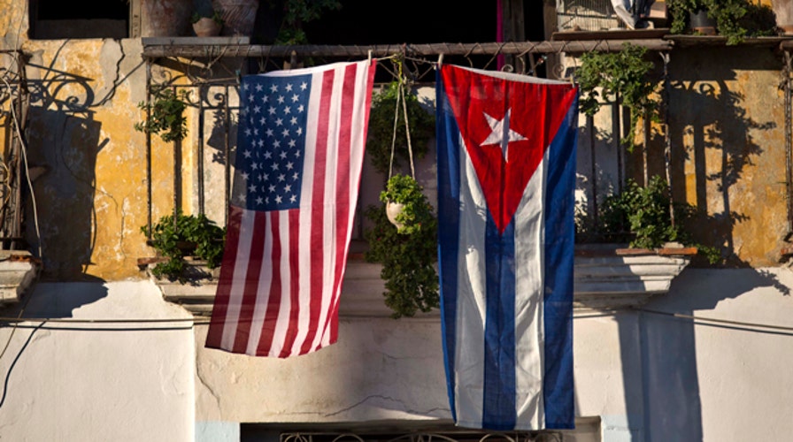Mixed reaction to shift on Cuba