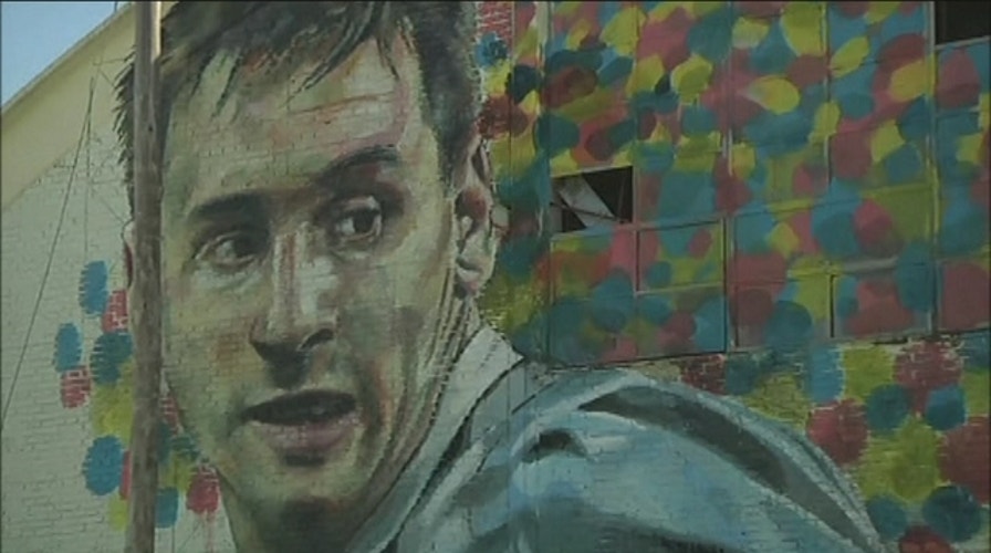Street artists create mural of Lionel Messi
