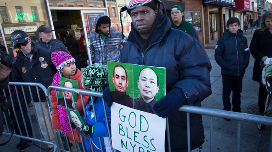 New threats emerge as slain NYPD officer is remembered