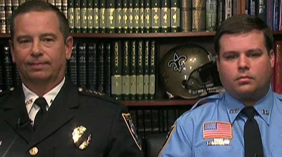 New Orleans police hand out $100 bills