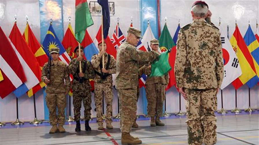 US and NATO mark end to combat operation in Afghanistan