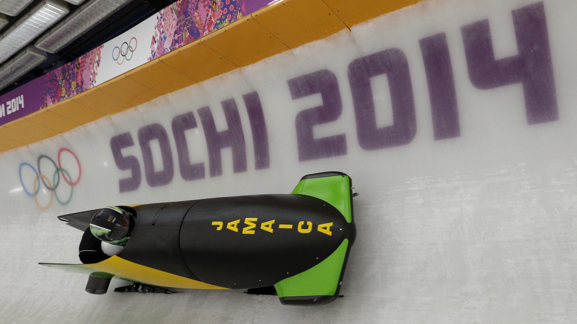 The JAM-1 sled from Jamaica, takes a turn during a training run for the men's two-man bobsled at the 2014 Winter Olympics, Thursday, Feb. 6, 2014, in Krasnaya Polyana, Russia. (AP Photo/Michael Sohn)