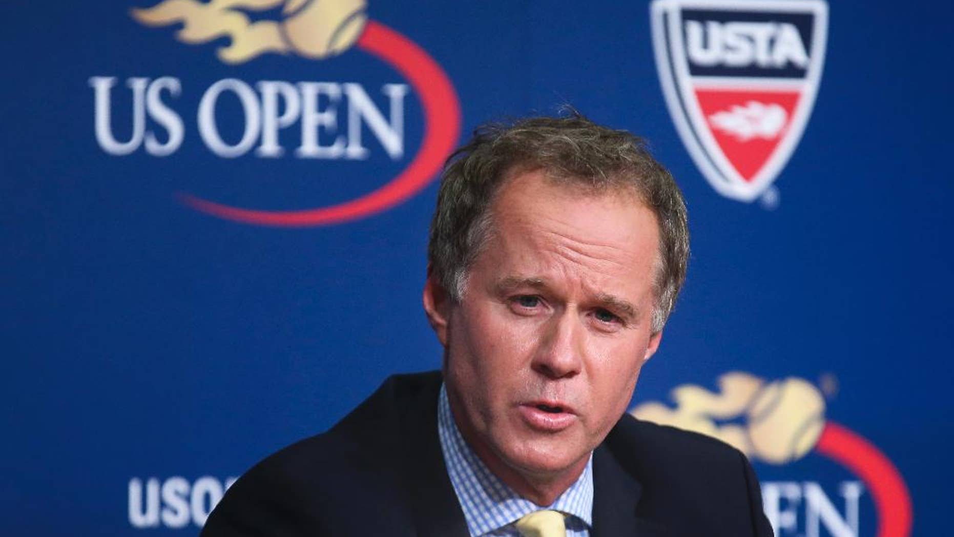 FILE - In this Sept. 3, 2014, file photo, Patrick McEnroe announces his resignation as the U.S. Tennis Association's general manager of player development, at a news conference at the U.S. Open tennis tournament in New York. Patrick McEnroe is the new co-director of The John McEnroe Tennis Academy. Patrick will join director Lawrence Kleger at the academy, which has been open to New York area youth since 2010. (AP Photo/John Minchillo, File)